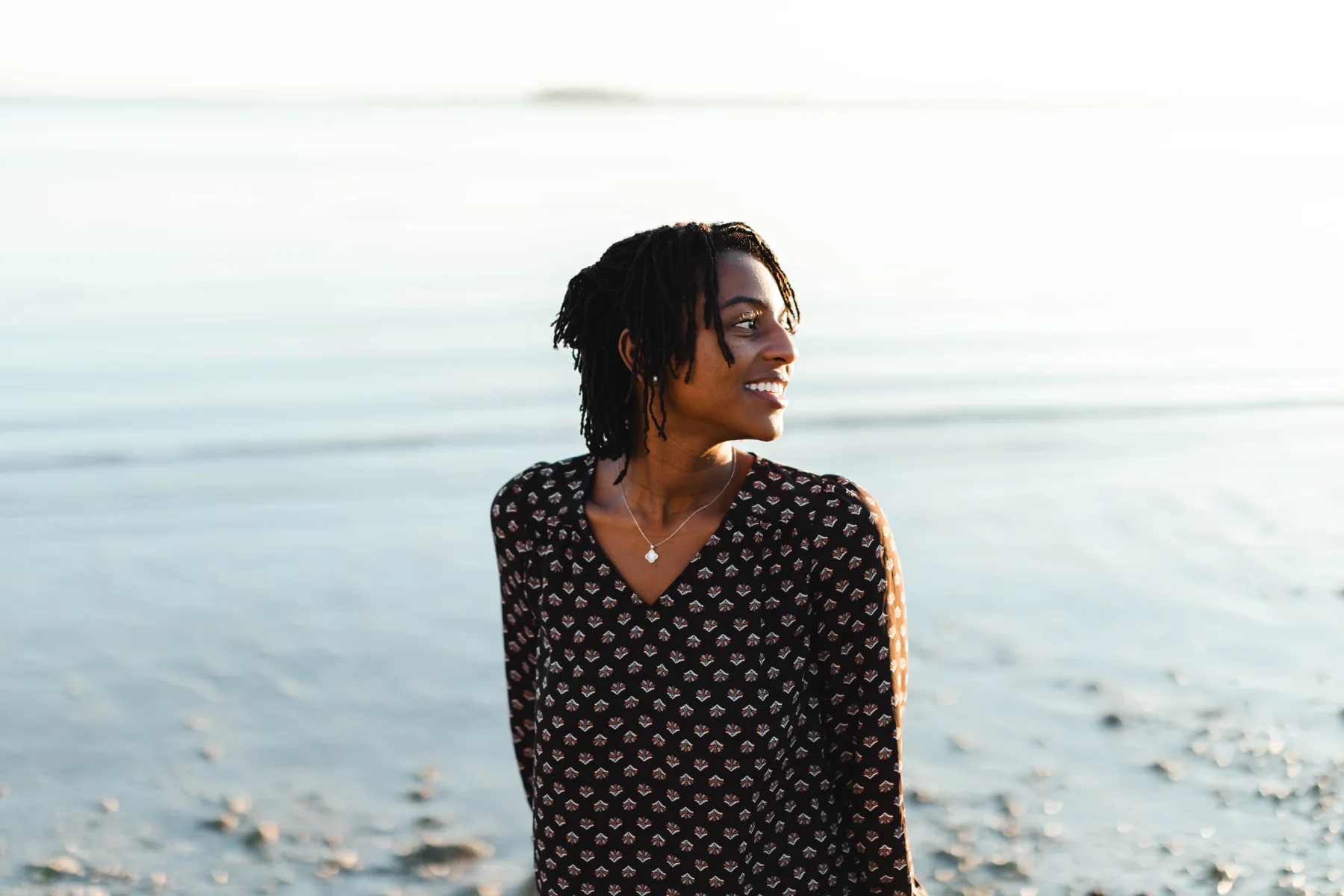 Portrait of Zxamara Jester, founder of ZJ Productions, on the Tampa Bay waterfront at sunset