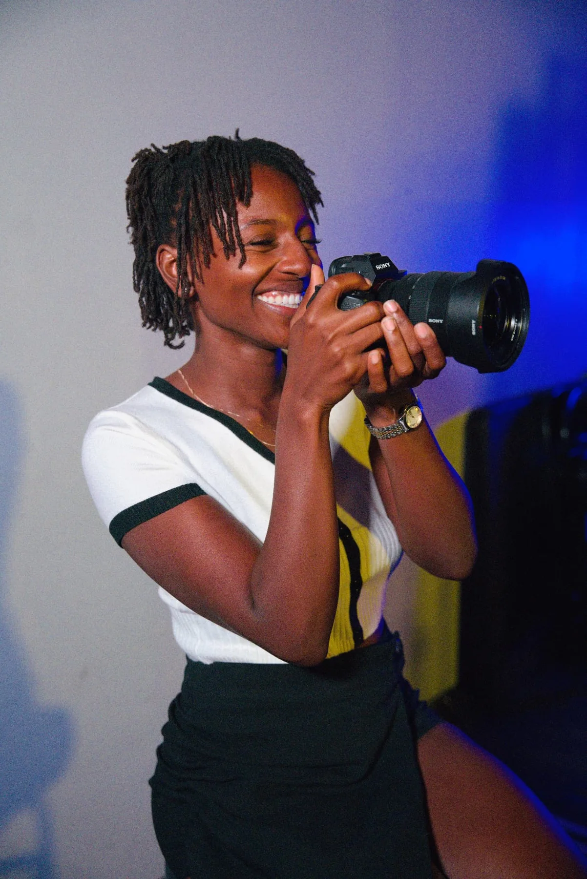 Zxamara Jester laughing while holding a Sony camera