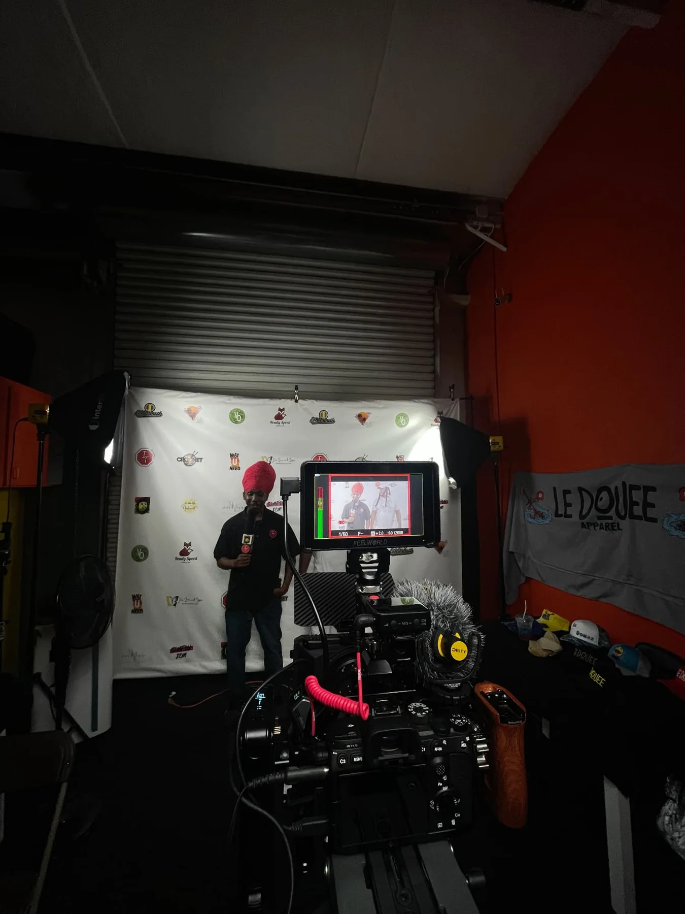 Behind the scenes of a ZJ Productions studio interview setup with camera and monitor